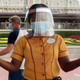 A Disney World cast member greets people during July 23's reopening.